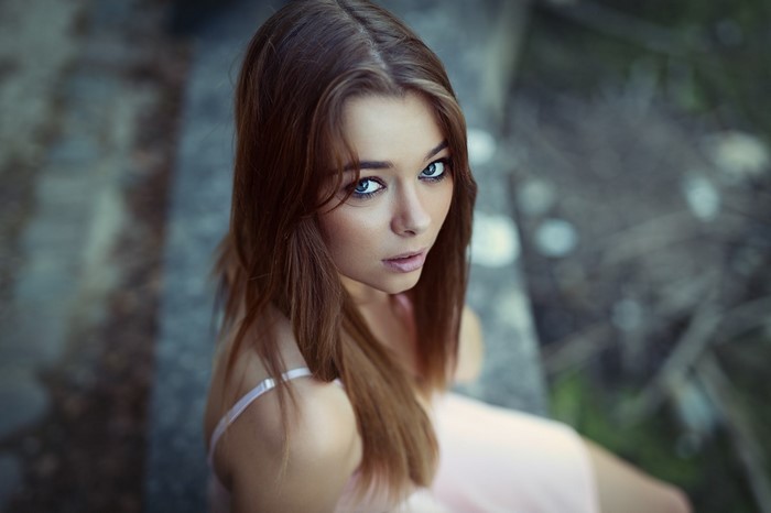 Woman with long brown hair and blue eyes