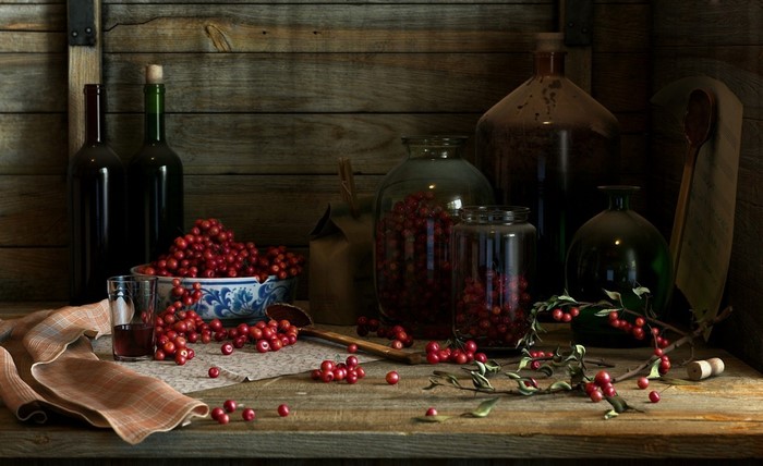 Still life with cranberries and bottles