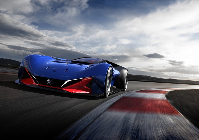 Blue Peugeot L500 R HYbrid supercar on a race track