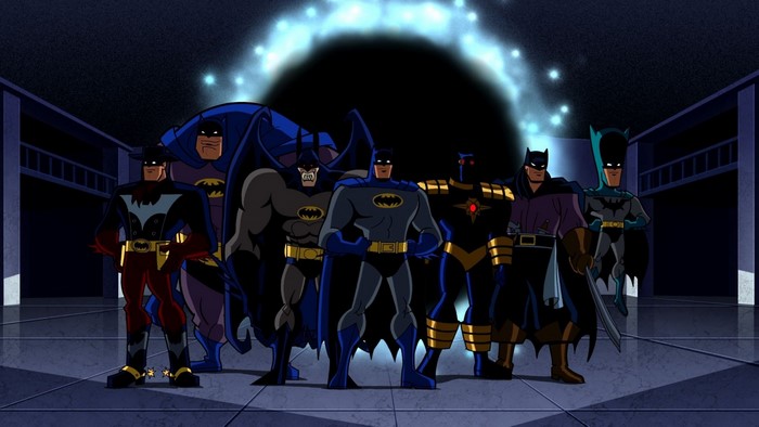 Multiple Batmen standing in a dark room with a portal