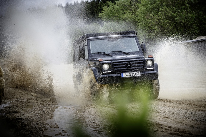 Black Mercedes-Benz G 350 d Professional driving through water