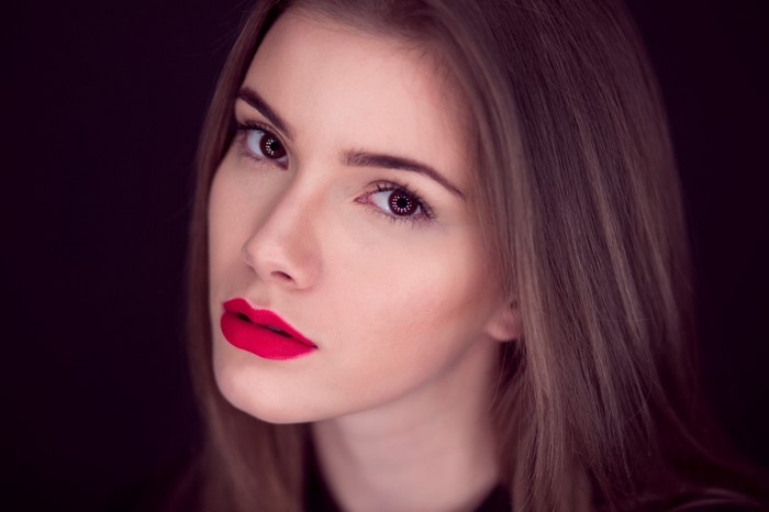 Close-up portrait of a woman with red lipstick