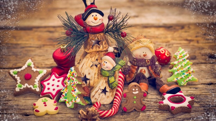 Christmas ornaments and cookies on wooden background