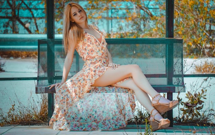 Redhead Model Sitting in Floral Dress with Wedge Shoes