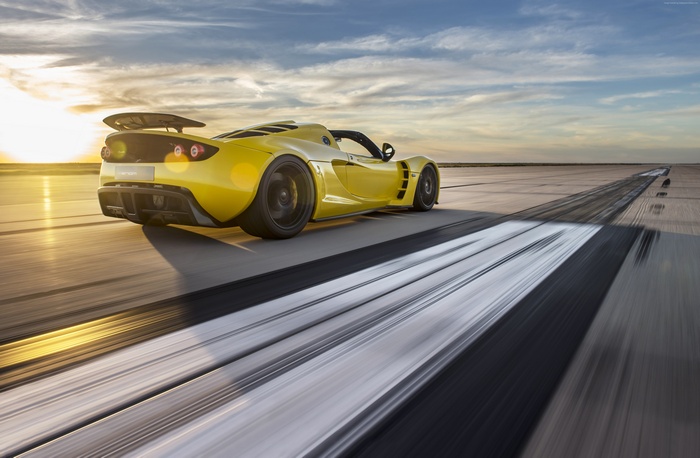 Yellow Hennessey Venom GT Spyder on a Racetrack