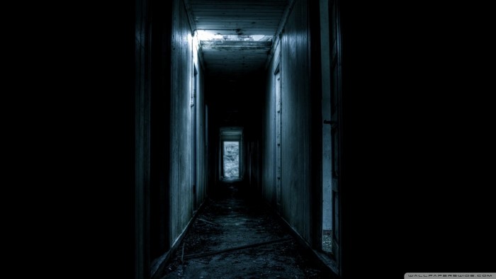 Abandoned hallway with light at the end
