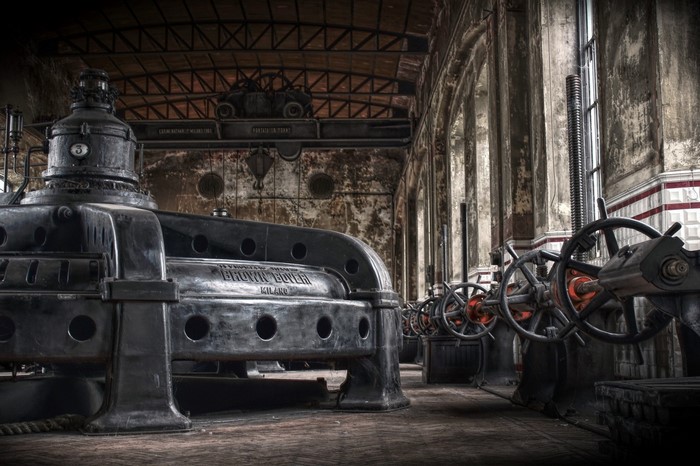 Abandoned industrial factory with large machinery
