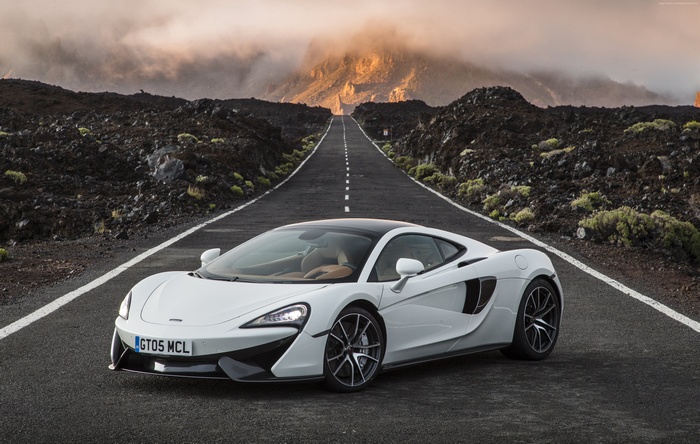 White McLaren 570S on a volcanic road