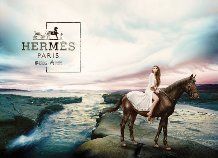 Woman riding a horse with Hermes Paris logo