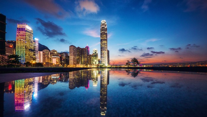 Hong Kong cityscape at dusk with reflections