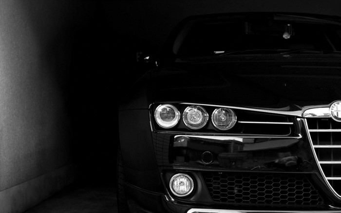 Black Alfa Romeo sports car headlights and grille