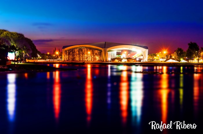 Amphitheater reflected in water at dusk