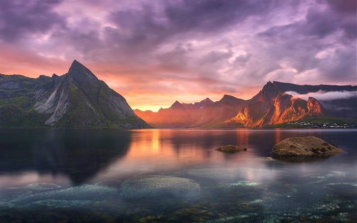 Sunset over mountains and sea in Lofoten