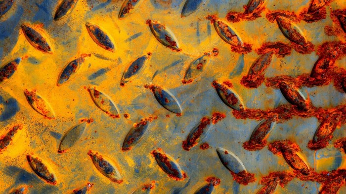 Close-up of rusted diamond plate metal texture