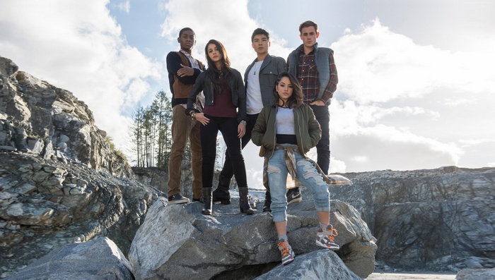 Power Rangers team standing on rocks