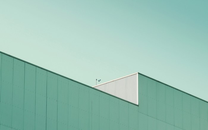 Minimalist building facade against a clear sky