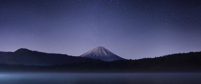 Mount Fuji under a starry night sky