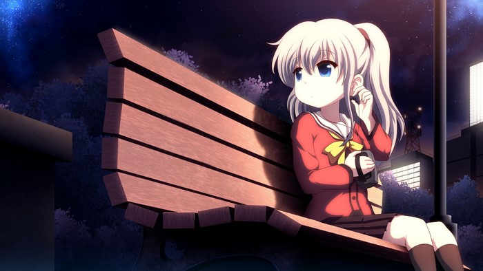 Tomori Nao from Charlotte wearing headphones on a bench at night