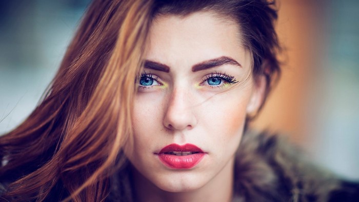 Close-Up Portrait of Woman with Blue Eyes and Red Lips