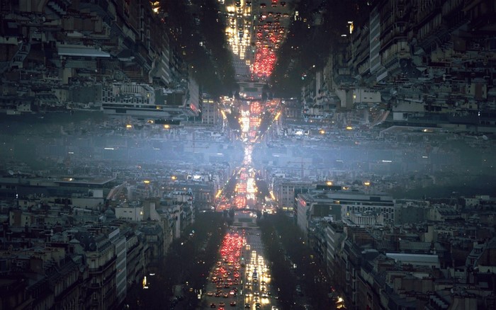 Surreal Cityscape at Night with Mirrored Reflections