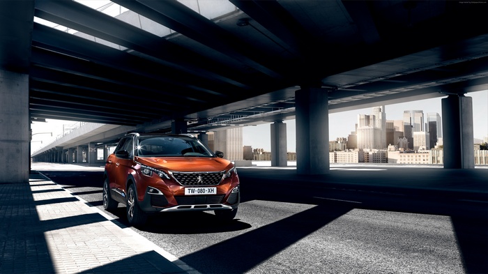 Orange Peugeot 3008 Crossover under a bridge