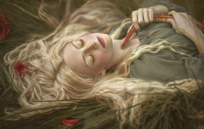 Woman with blonde hair and a snake