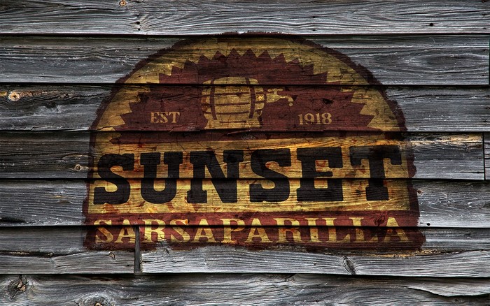 Sunset Sarsaparilla sign on wooden wall