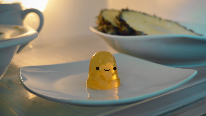 Yellow jelly with smiley face on plate