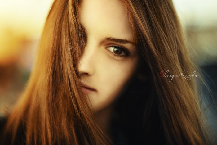 Portrait of a young woman with long brown hair