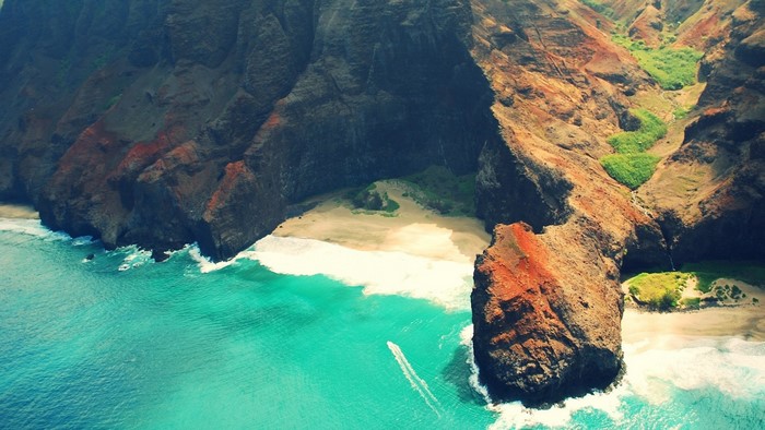 Aerial view of Na Pali Coast cliffs and ocean