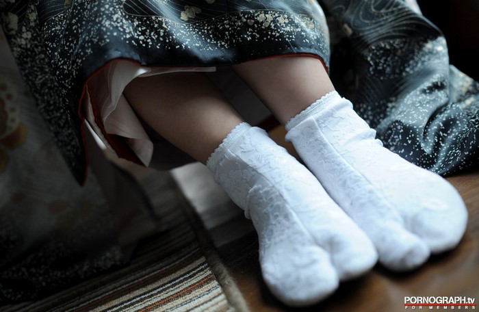 Woman wearing traditional Japanese kimono and white tabi socks