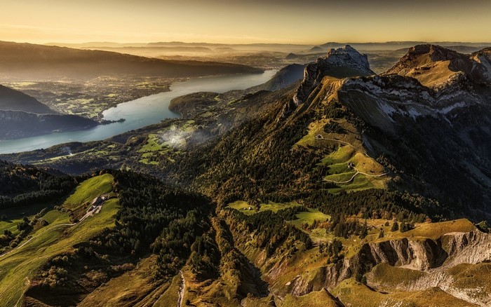 Aerial view of a lake and mountains at sunset