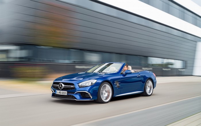 Blue Mercedes-Benz SL65 AMG Convertible driving on road
