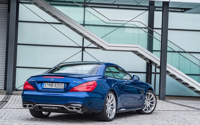 Blue Mercedes Benz SL65 AMG parked outside modern building