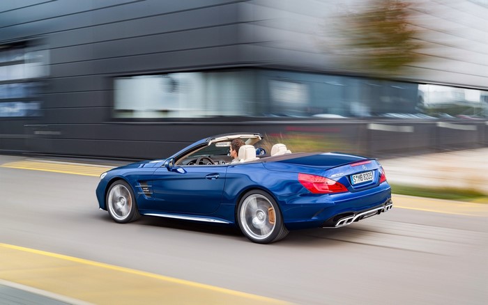 Blue Mercedes-Benz SL65 AMG Convertible driving on road