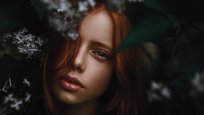 Portrait of a redhead woman with blue eyes