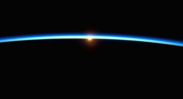 Sunrise over Earth's atmosphere from space