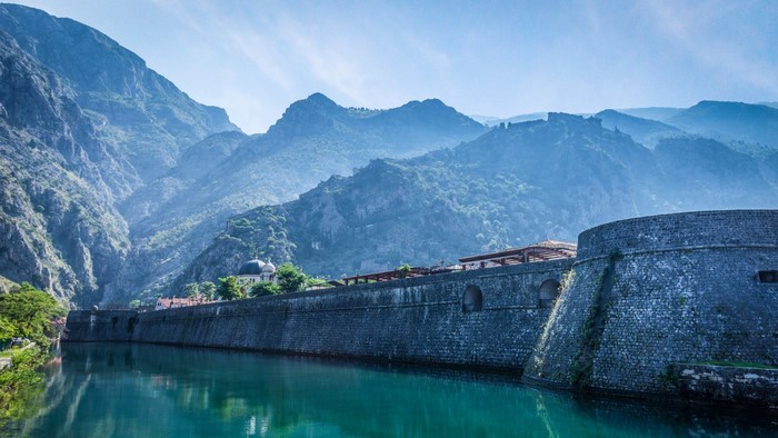 Kotor town fortress walls and mountains in Montenegro