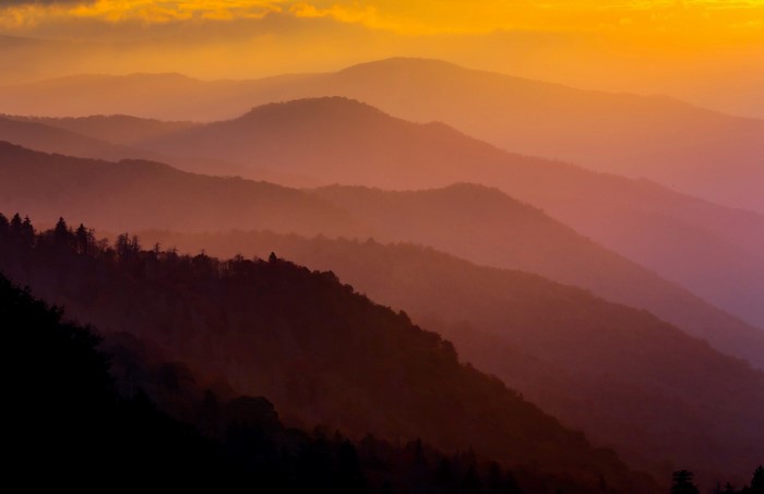 Mountain range at sunset with atmospheric haze