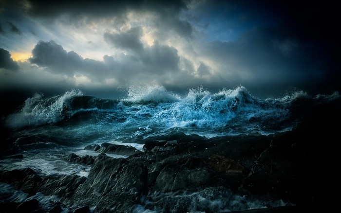 Stormy Ocean Waves at Dusk under Dramatic Sky