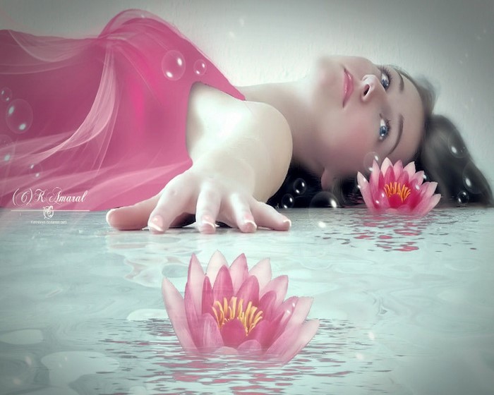 Woman in pink fabric with water lilies