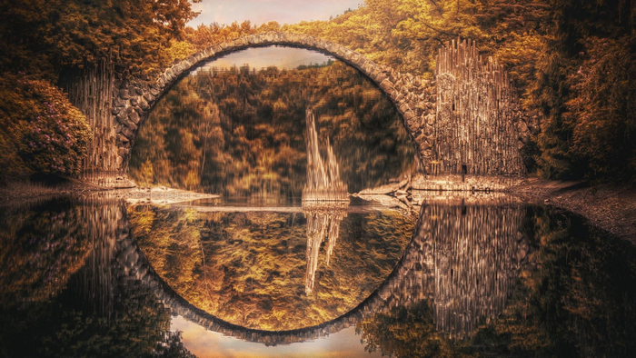 Rakotzbrücke bridge reflection in autumn lake