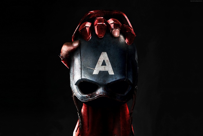Captain America mask held by Iron Man's hand