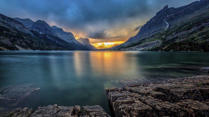 Sunrise Over Mountain Lake and Rocky Shore