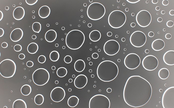 Water droplets on a gray surface