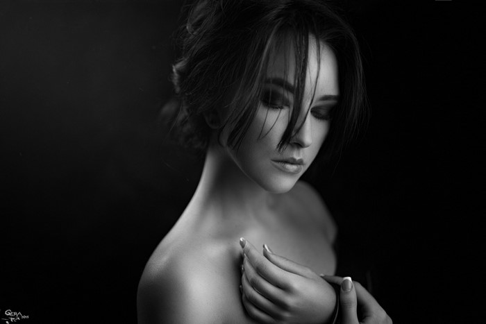 Monochrome portrait of a woman with hair over her face