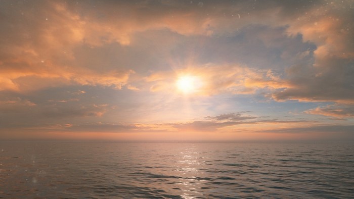 Sunset over the ocean with clouds