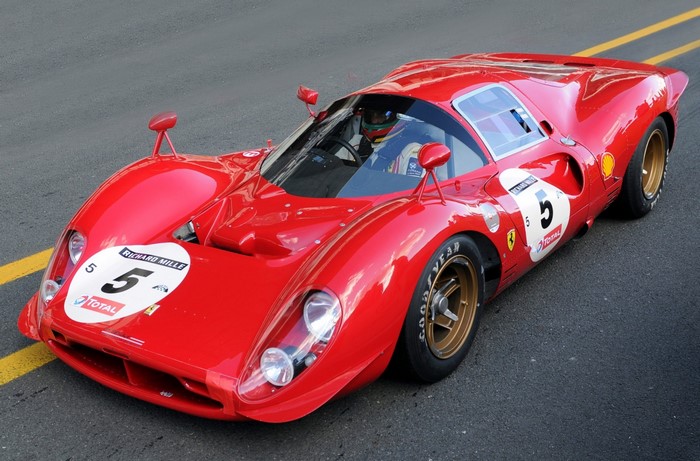 Red Ferrari 512 S race car with driver