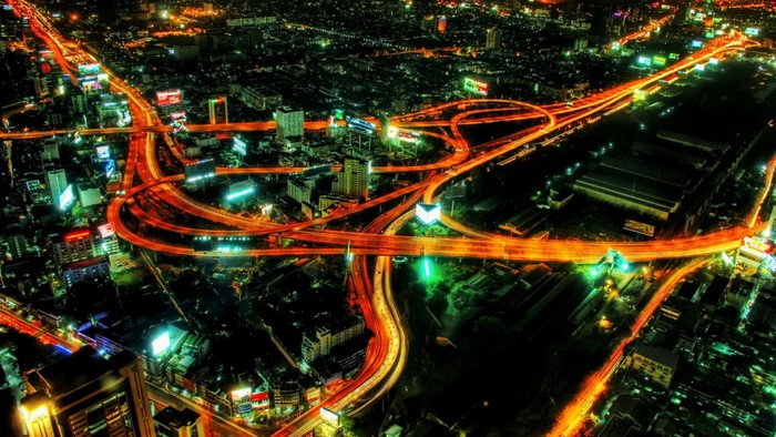 Bangkok cityscape at night with illuminated highways