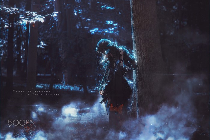 Cosplayer in a dark forest with special effects